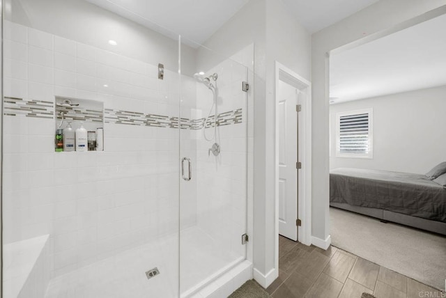 bathroom with a shower with shower door