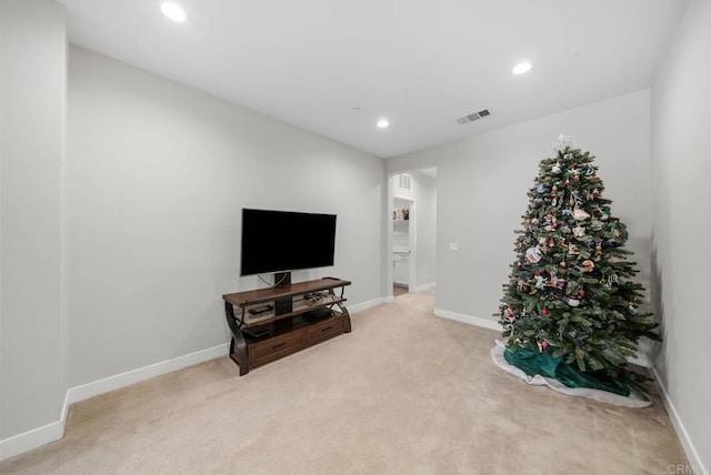 sitting room with light colored carpet