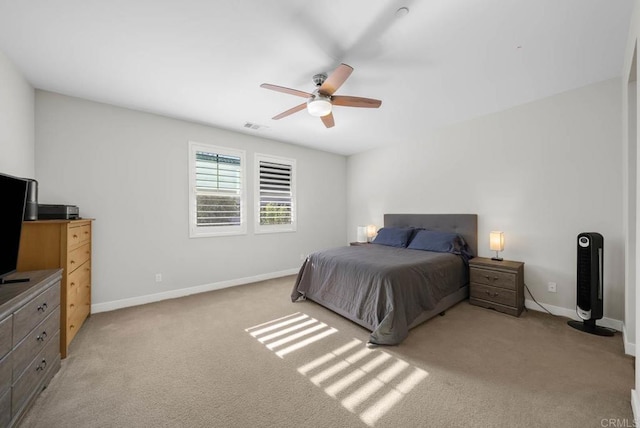 bedroom with light carpet and ceiling fan