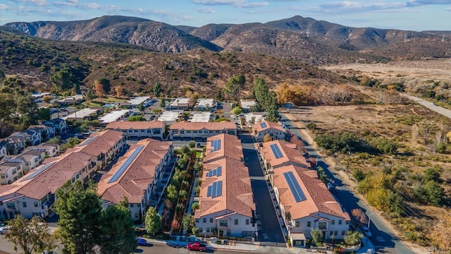 drone / aerial view featuring a mountain view