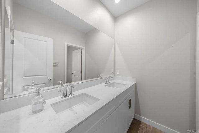 bathroom with vanity and hardwood / wood-style flooring