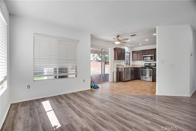 kitchen featuring stainless steel appliances, recessed lighting, visible vents, light countertops, and light wood-style flooring