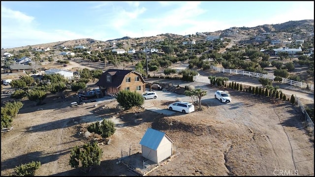 birds eye view of property featuring a mountain view