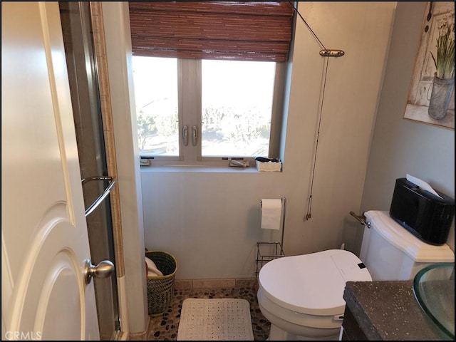 bathroom with vanity and toilet