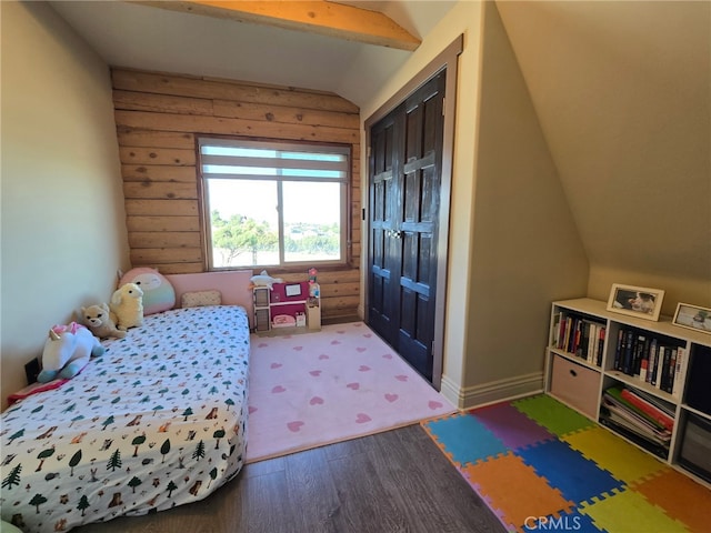 bedroom featuring lofted ceiling and hardwood / wood-style floors