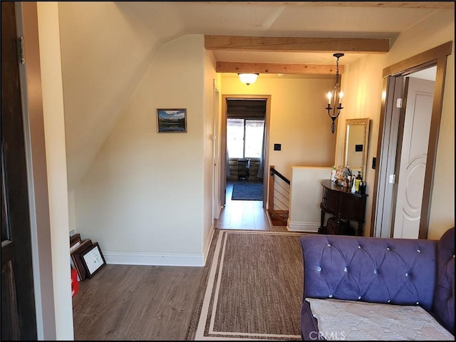 bedroom featuring beamed ceiling and wood-type flooring