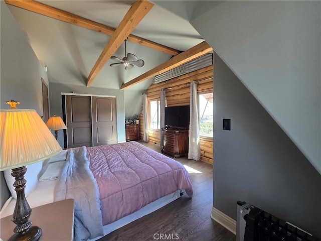 bedroom with dark hardwood / wood-style flooring, vaulted ceiling with beams, and rustic walls