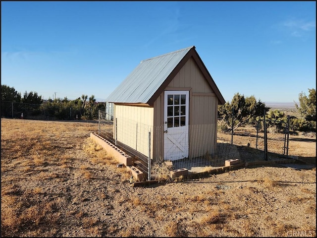 view of outdoor structure with a rural view