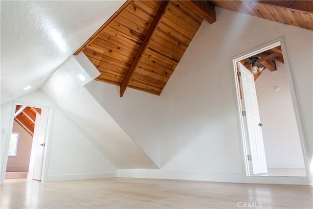 bonus room featuring wood ceiling and vaulted ceiling with beams