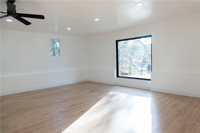 spare room with ceiling fan and light hardwood / wood-style flooring