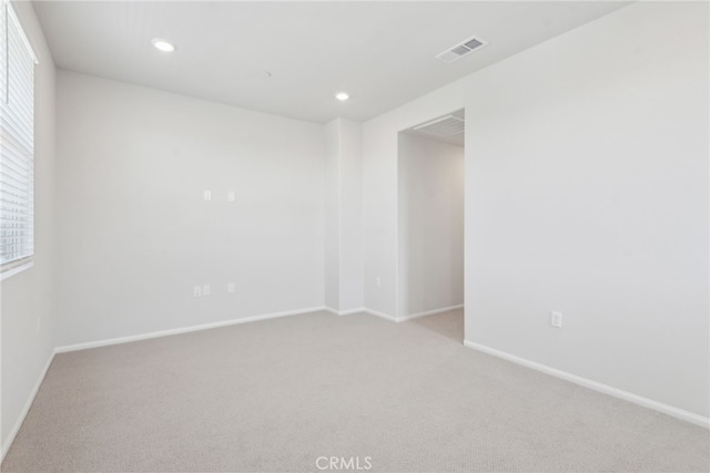 2718 Crozier Ct, Pomona, CA 91767 - unfurnished room with light colored carpet, baseboards, recessed lighting, and plenty of natural light