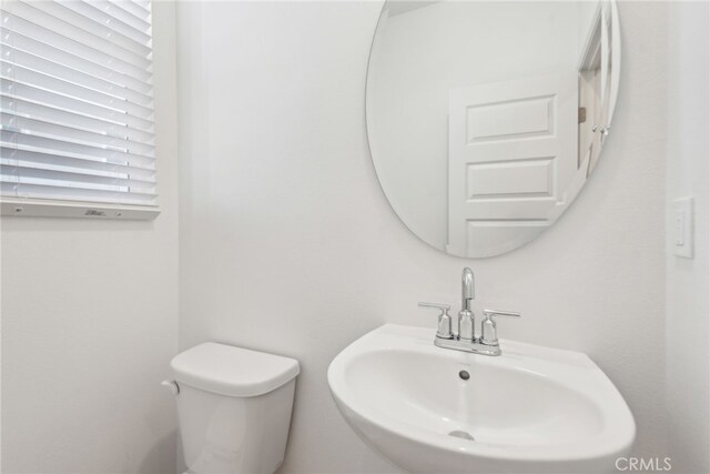 2718 Crozier Ct, Pomona, CA 91767 - half bathroom featuring a sink and toilet