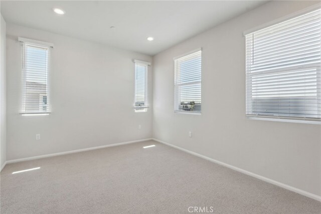 2718 Crozier Ct, Pomona, CA 91767 - unfurnished room with healthy amount of natural light, baseboards, carpet, and recessed lighting