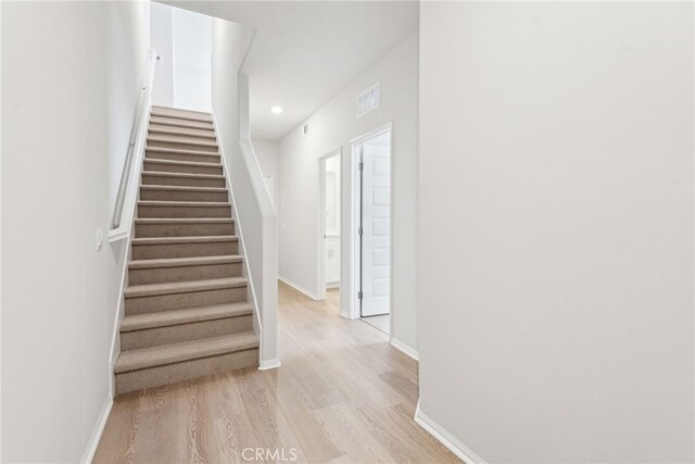 2718 Crozier Ct, Pomona, CA 91767 - staircase featuring wood finished floors, baseboards, and recessed lighting