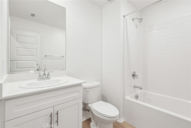 2718 Crozier Ct, Pomona, CA 91767 - bathroom with vanity, toilet, shower / tub combination, wood finished floors, and baseboards