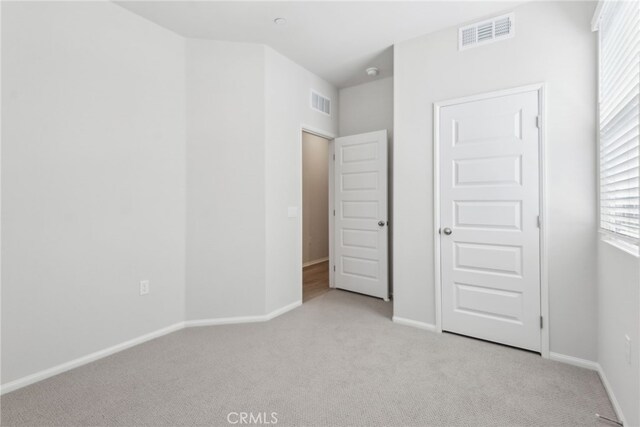 2718 Crozier Ct, Pomona, CA 91767 - unfurnished bedroom with light colored carpet and baseboards