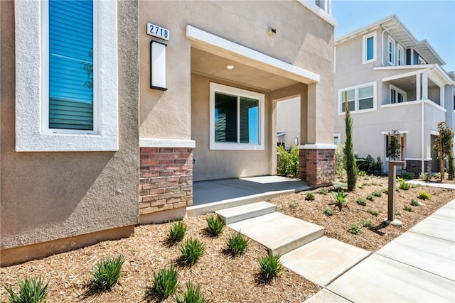 2718 Crozier Ct, Pomona, CA 91767 - view of exterior entry with brick siding and stucco siding