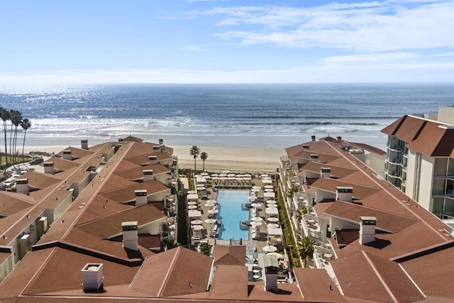 drone / aerial view with a beach view and a water view