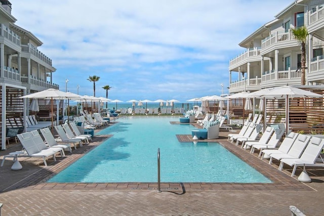 view of pool featuring a water view