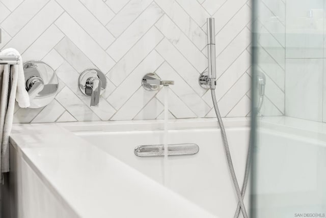 interior details featuring a shower