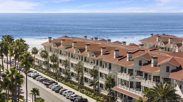 exterior space with a beach view and a water view