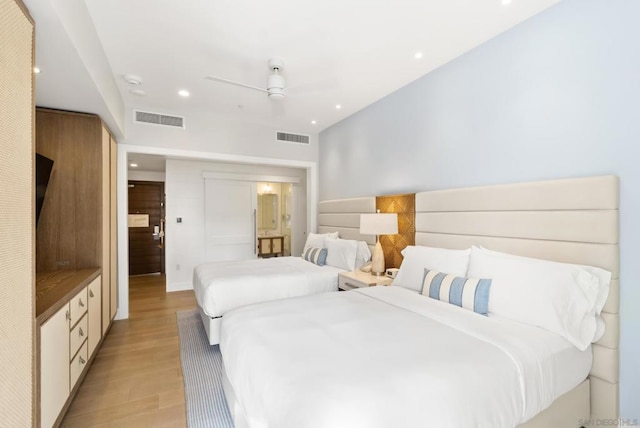 bedroom featuring ceiling fan and light hardwood / wood-style floors