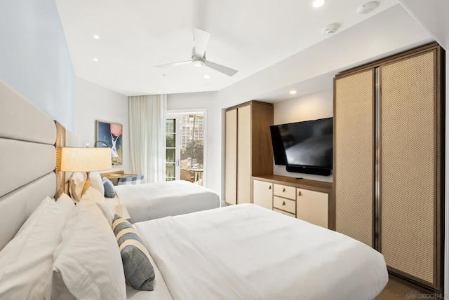 bedroom featuring two closets and ceiling fan