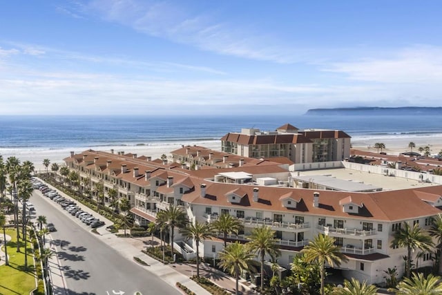 bird's eye view featuring a view of the beach and a water view