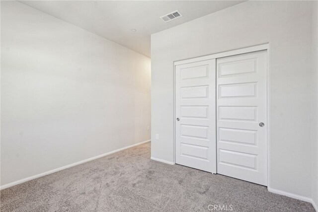 2720 Crozier Ct, Pomona, CA 91767 - unfurnished bedroom featuring carpet, baseboards, and a closet