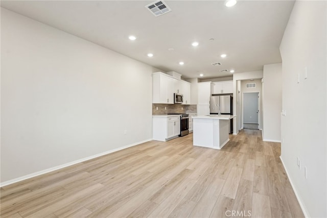 2720 Crozier Ct, Pomona, CA 91767 - kitchen featuring stainless steel appliances, light wood-style flooring, open floor plan, light countertops, and recessed lighting
