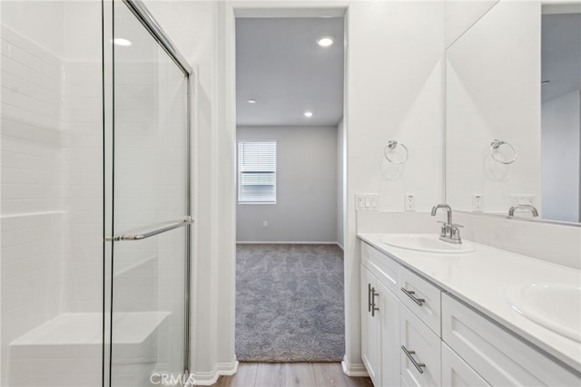 2720 Crozier Ct, Pomona, CA 91767 - full bath featuring a stall shower, double vanity, baseboards, wood finished floors, and recessed lighting