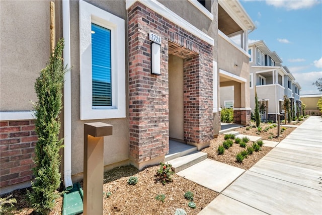 2720 Crozier Ct, Pomona, CA 91767 - doorway to property featuring stucco siding and brick siding