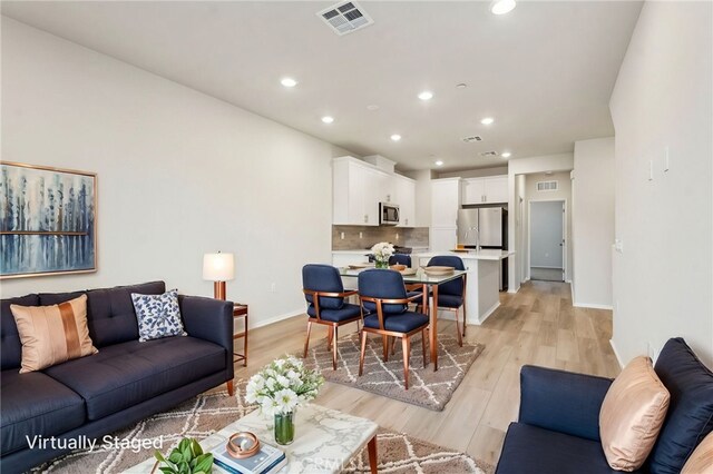 2720 Crozier Ct, Pomona, CA 91767 - living area featuring light wood-style floors, recessed lighting, and baseboards
