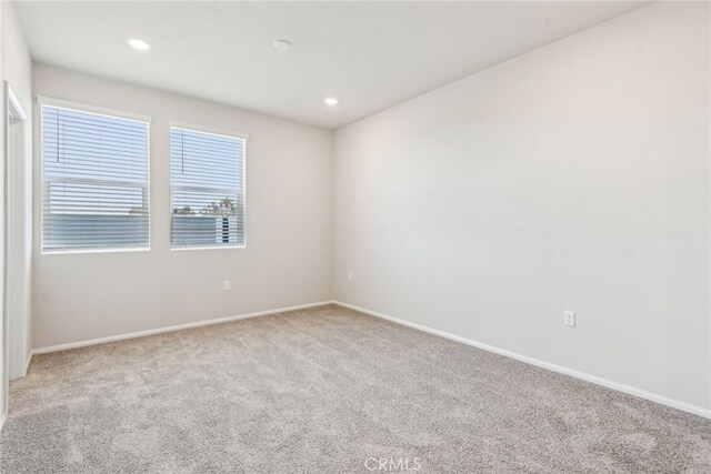 2720 Crozier Ct, Pomona, CA 91767 - empty room featuring light carpet, baseboards, and recessed lighting