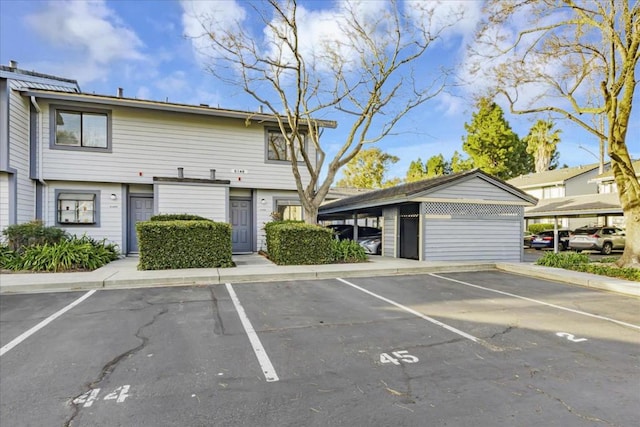 view of vehicle parking with a carport