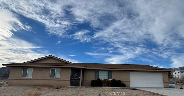 single story home featuring a garage