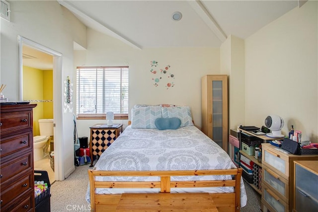 bedroom featuring vaulted ceiling and light carpet