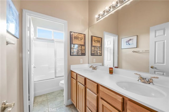 full bathroom featuring vanity, bathtub / shower combination, tile patterned floors, and toilet