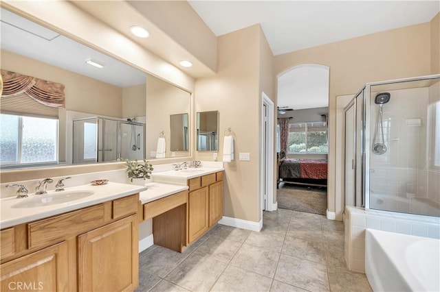 bathroom featuring tile patterned floors, a healthy amount of sunlight, independent shower and bath, and vanity