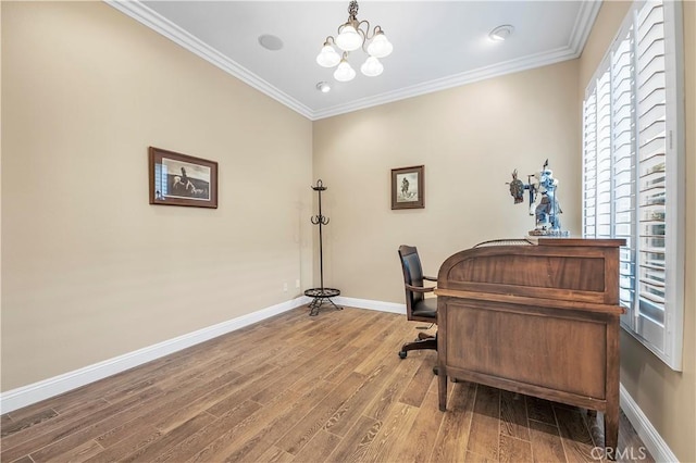 office space with an inviting chandelier, hardwood / wood-style flooring, and ornamental molding