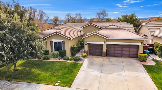 single story home with a garage and a front lawn