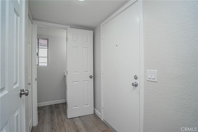 hallway with light wood-type flooring