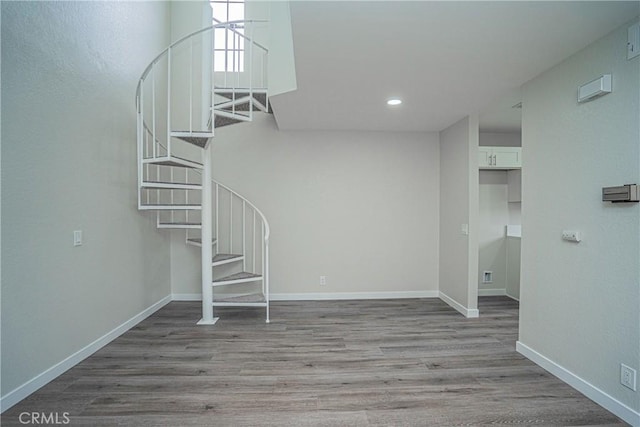 stairway with hardwood / wood-style flooring