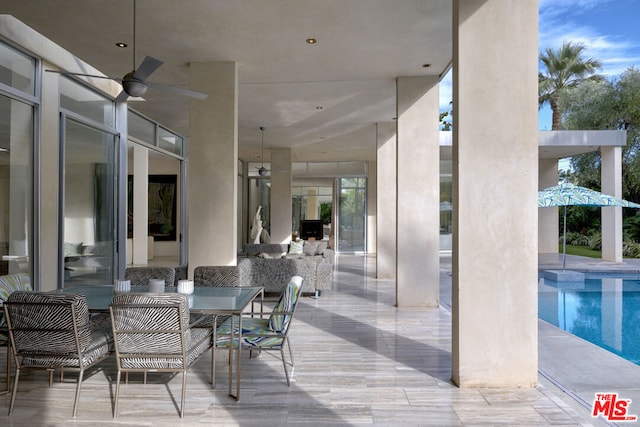 view of patio / terrace featuring ceiling fan