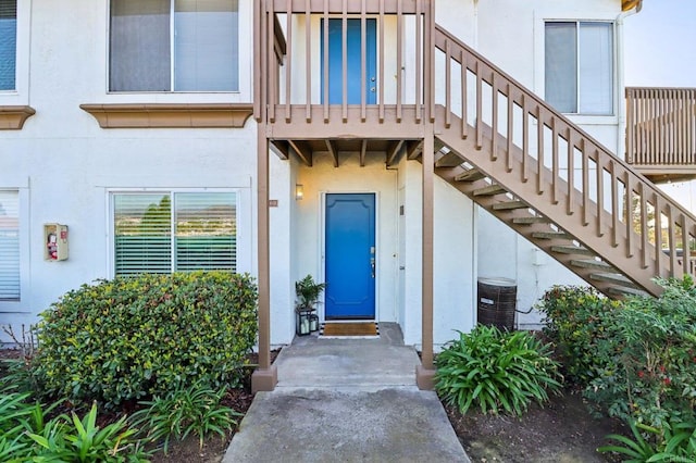 view of exterior entry with central AC unit