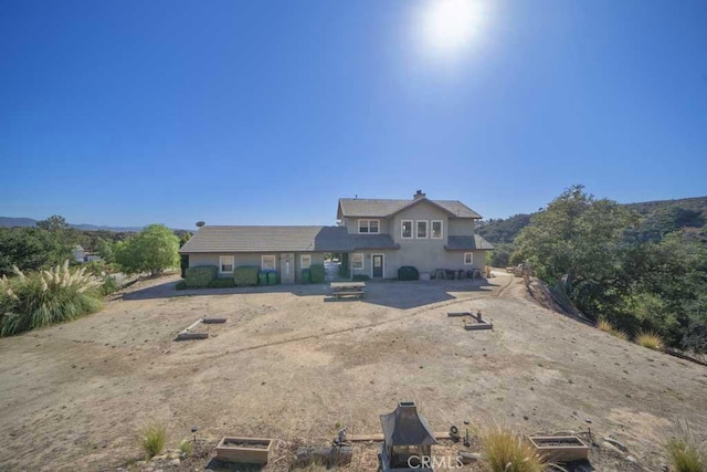 back of property featuring a patio area