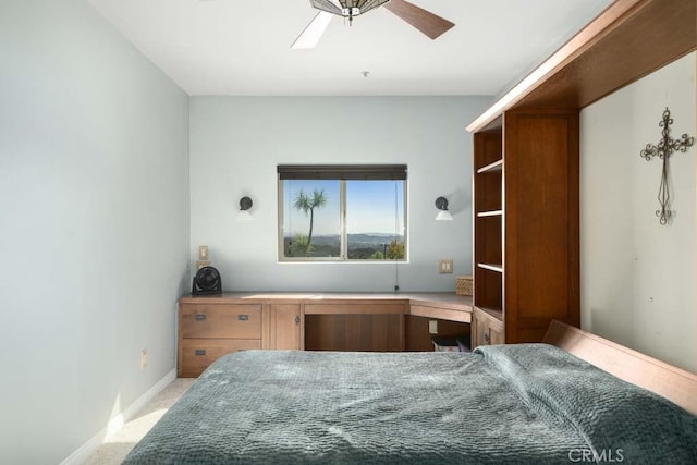 bedroom featuring light carpet and ceiling fan