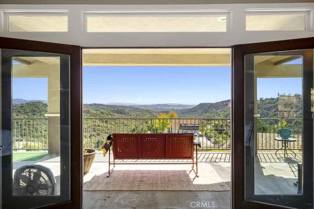 doorway to outside with a mountain view