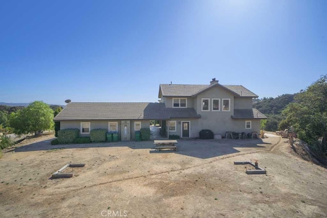 view of front of home featuring a patio area