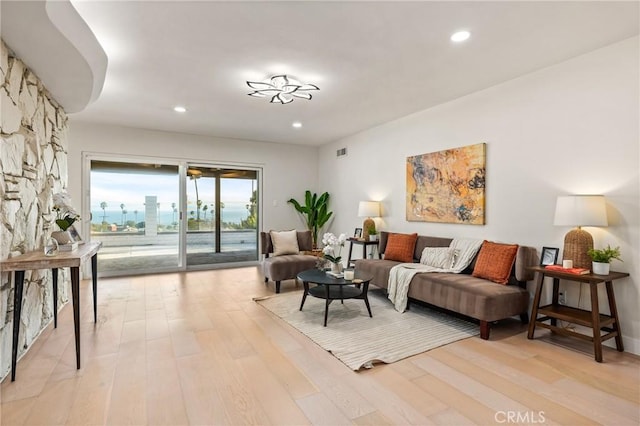 living room with light hardwood / wood-style flooring